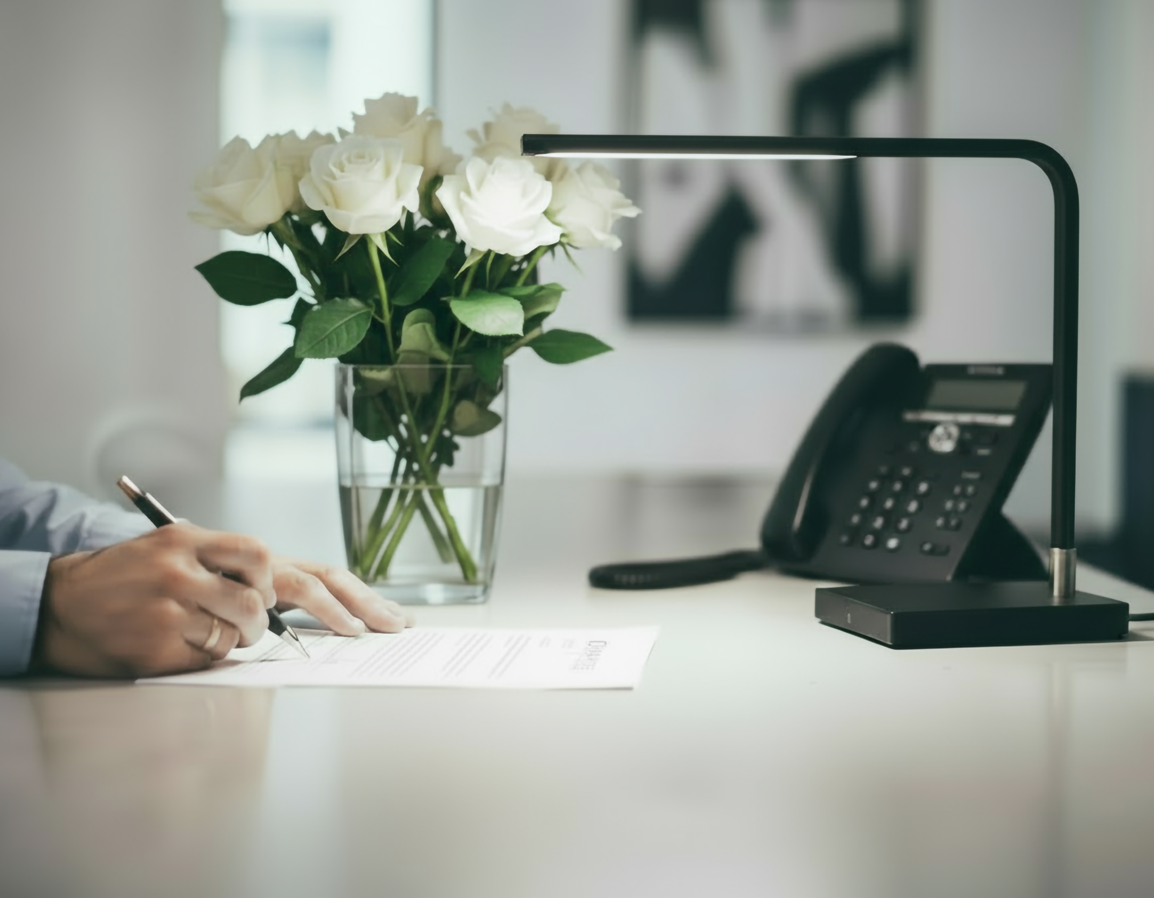 Firefly_Gemini Flash_Hands signing contract with vase with roses, phone and lamp 518082
