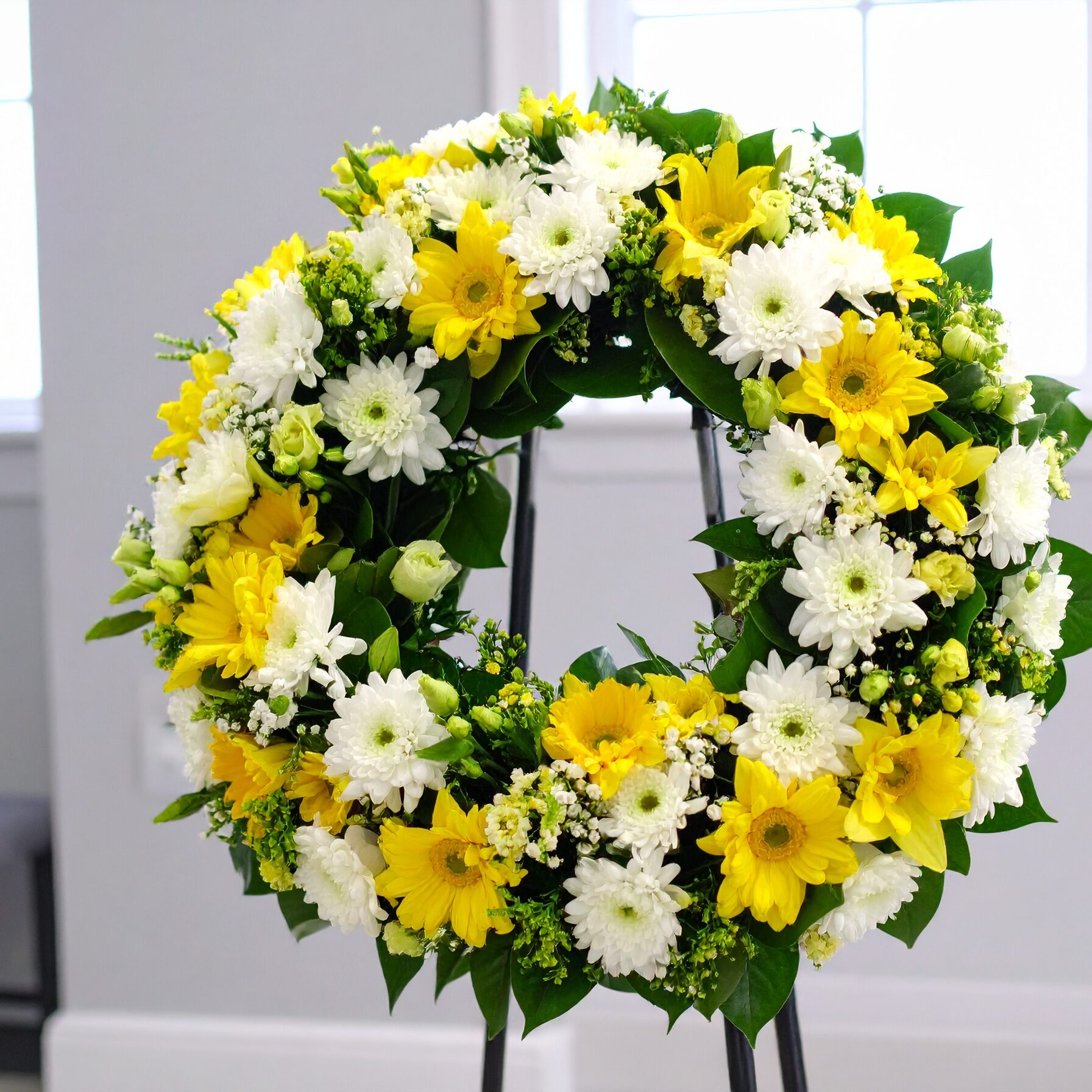 Firefly__funeral home The Bright Beauty Wreath is adorned in radiant yellow and pure white fl 688024
